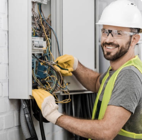 An apprentice working in a distribution board